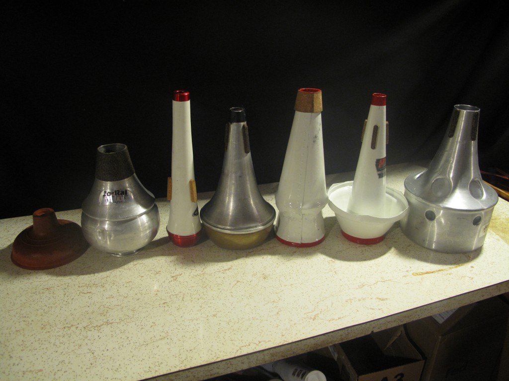 (l to r) plunger, harmon, pixie, straight, solo-tone, cup, bucket